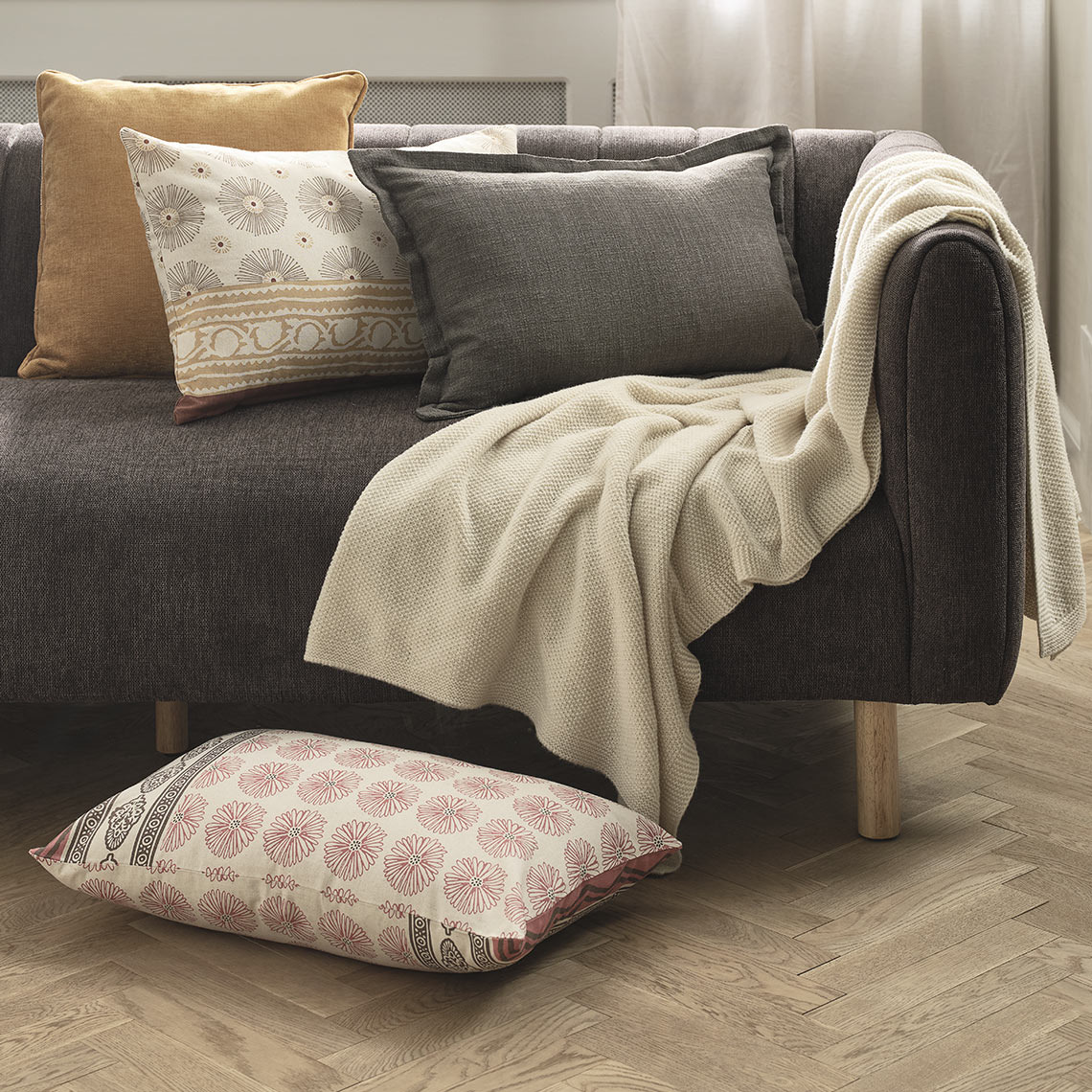 KATTEFOT patterned cushions and HUMLE throw Cushions and throw in sofa