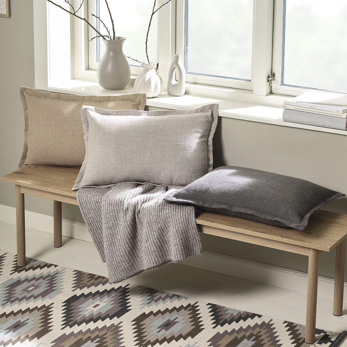 NATTVIOL cushion covers are available in brown, beige and latte Bench with cushions in different colours