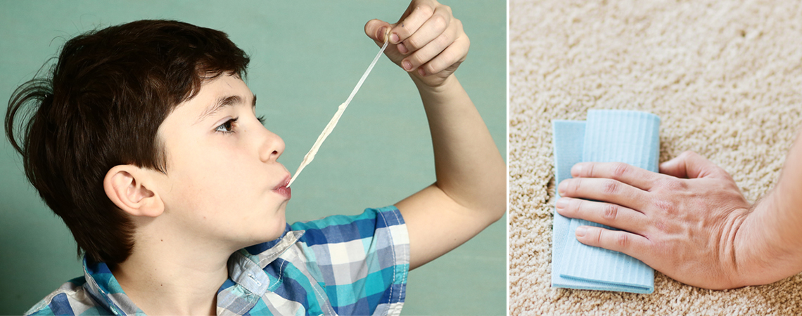 Dječak žvače žvaku i pored njega slika ruke koja krpom čisti tepih
